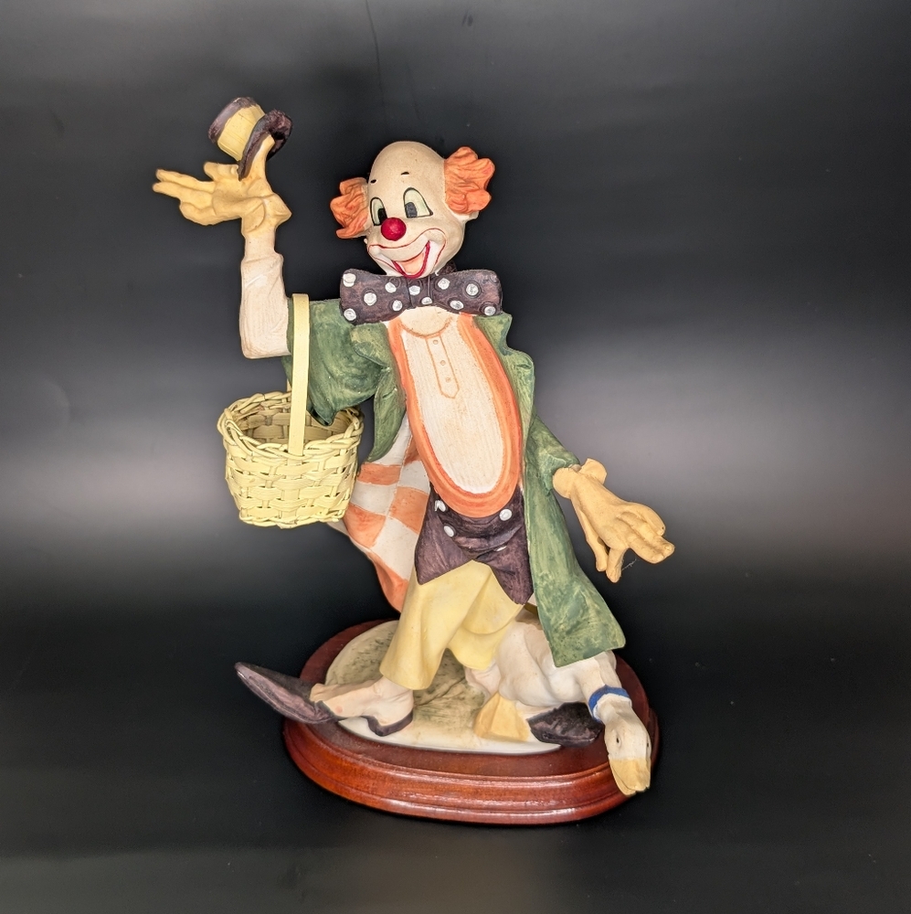 Whimsical Clown Figurine with Basket and duck.